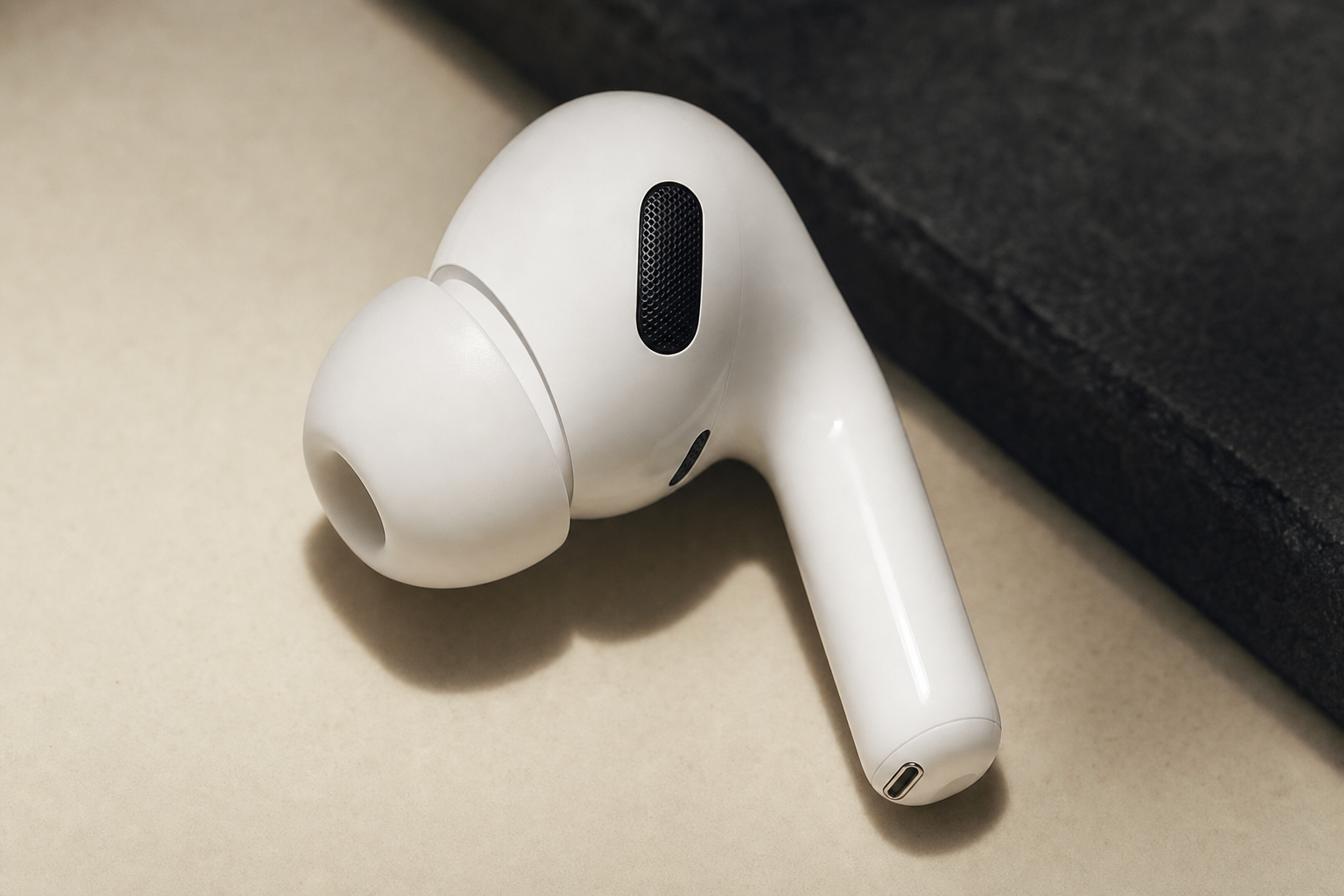Close-up of AirPods Pro 3 earbud showing ear tip detail and stem