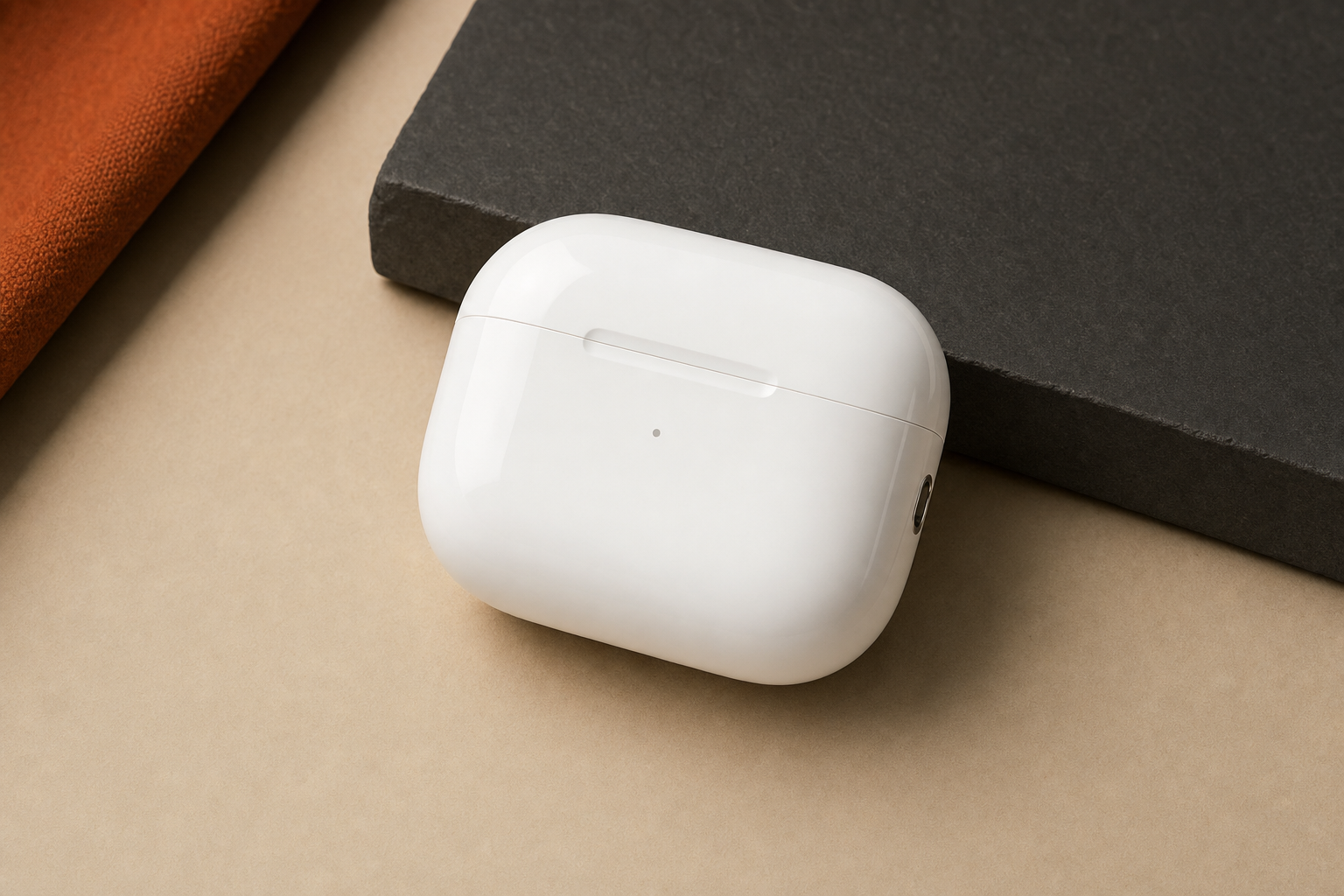 AirPods Pro 3 charging case closed on neutral surface