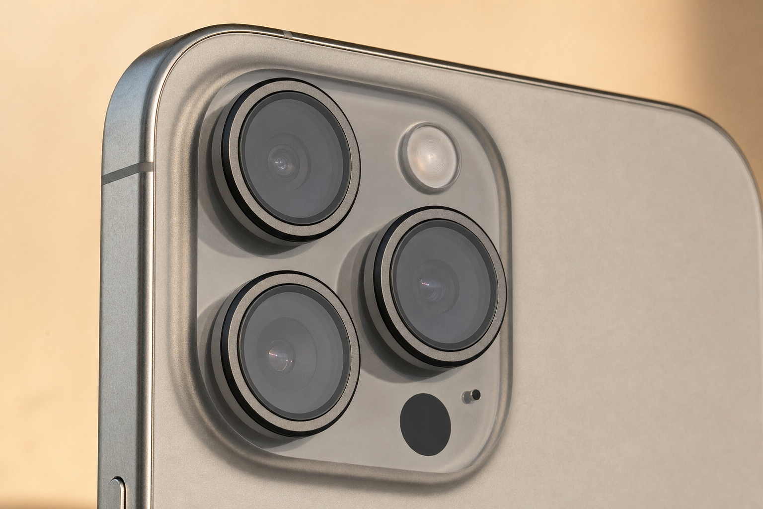 Camera lens protectors installed on iPhone 15 Pro Max camera module showing fit over each lens
