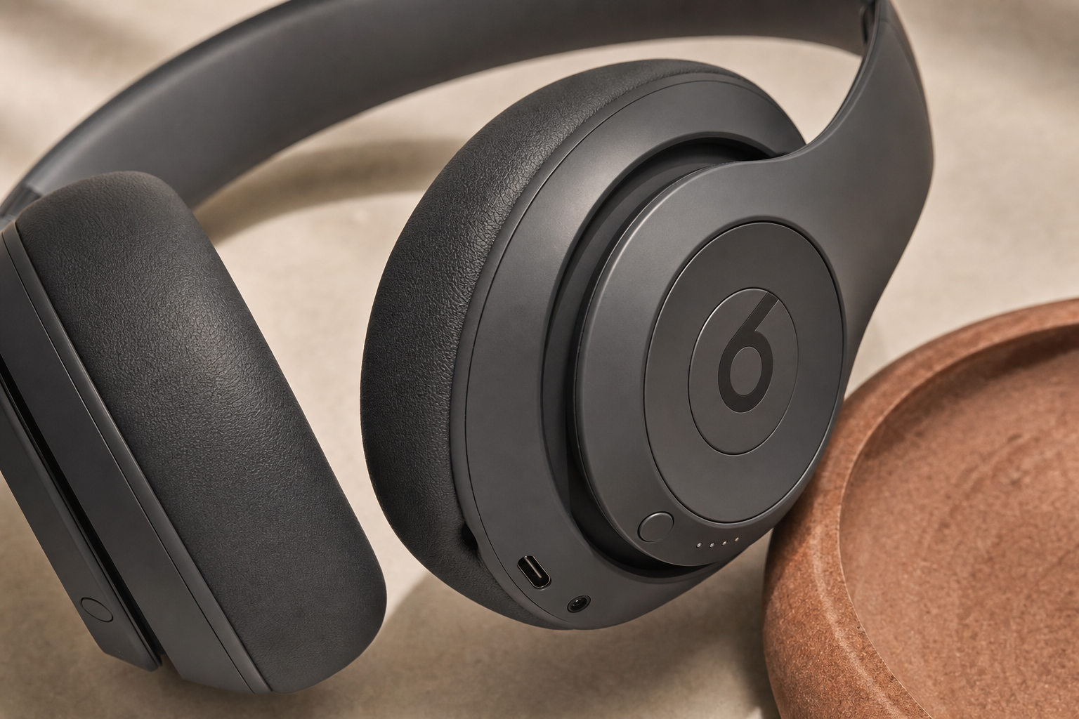 Close-up of Beats Studio Pro earcup and port area on a neutral background