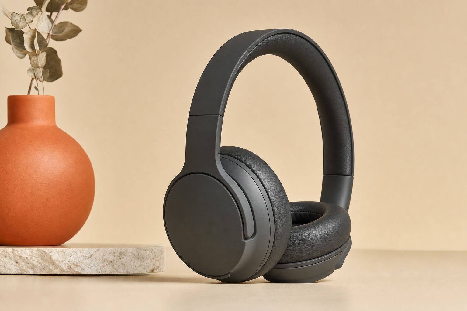 Side profile of over-ear wireless headphones showing earcup size and headband padding.
