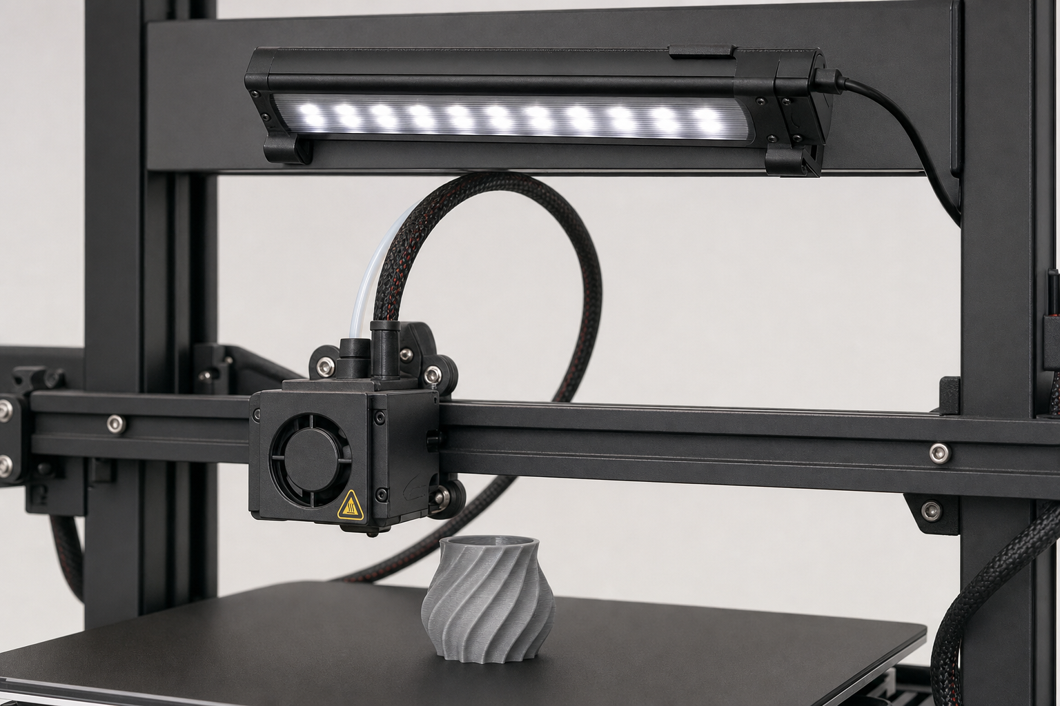 Close-up of the LED Lamp accessory on a compact 3D printer setup
